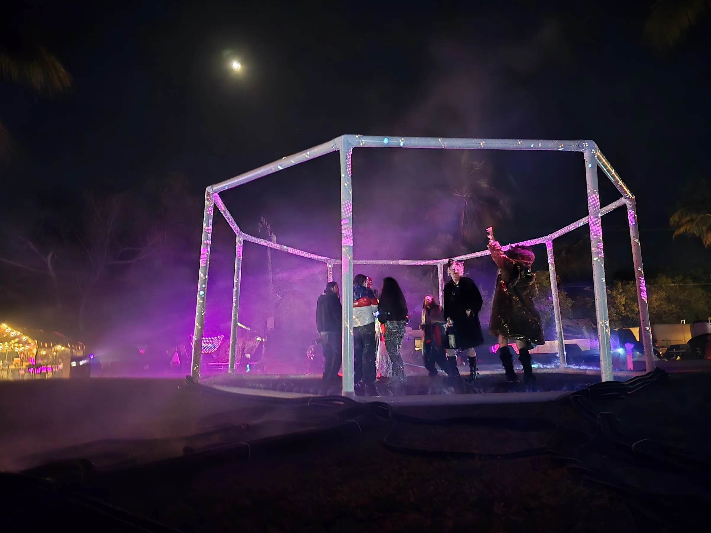 The Octagon under moonlight with fog spilling from the structure