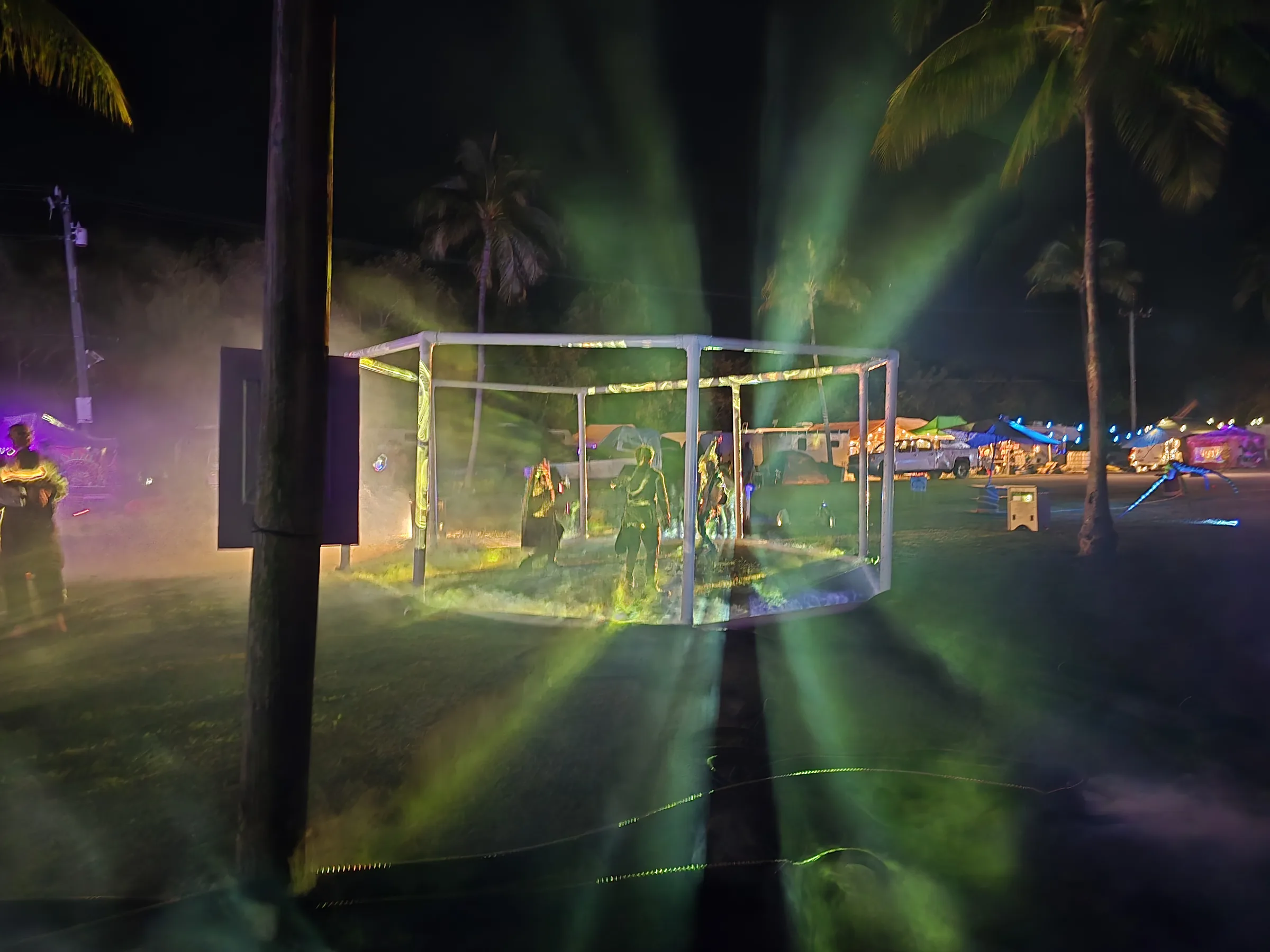 Purple projections surrounding visitors standing inside The Octagon