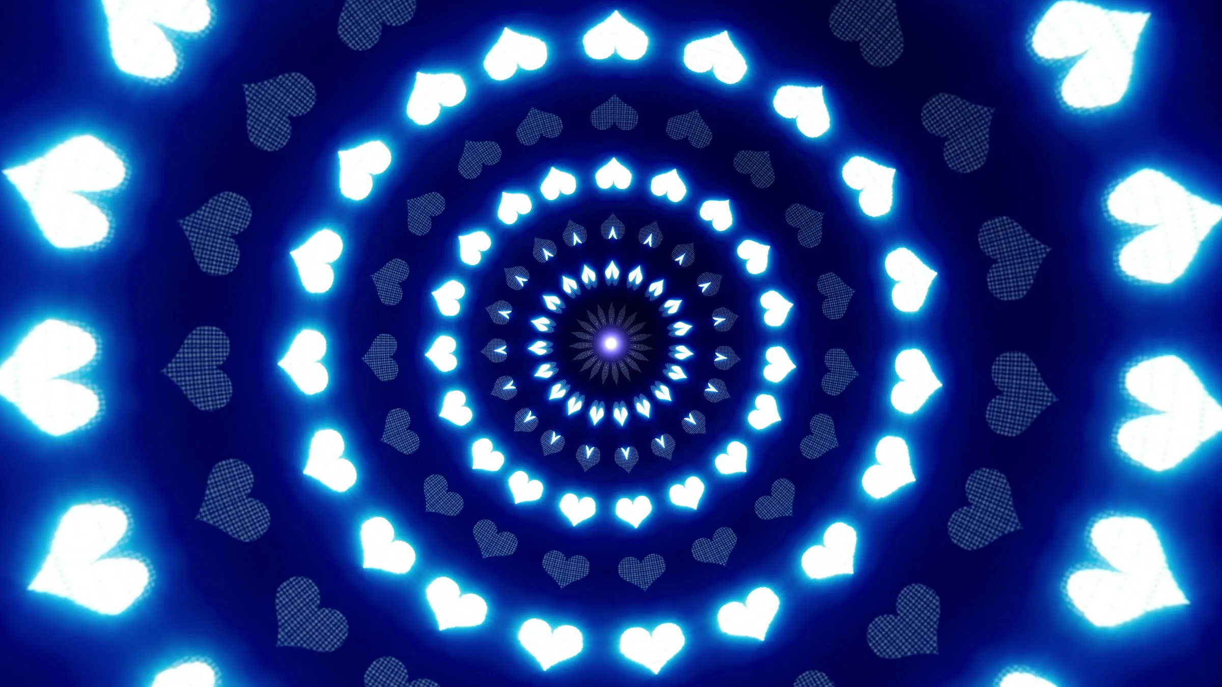 Kaleidoscopic blue motion graphics: rings of glowing hearts radiating from a bright centre